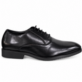 A single black leather oxford dress shoe with a low stacked heel and black laces, shown in a side profile on a white background.