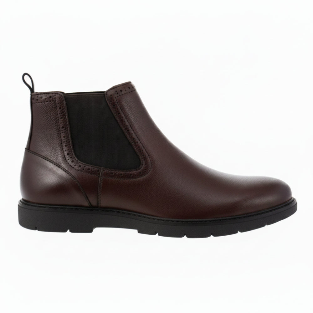 A dark brown suede Chelsea boot with a low black block heel and pull loop, shown in a side profile on a white background.