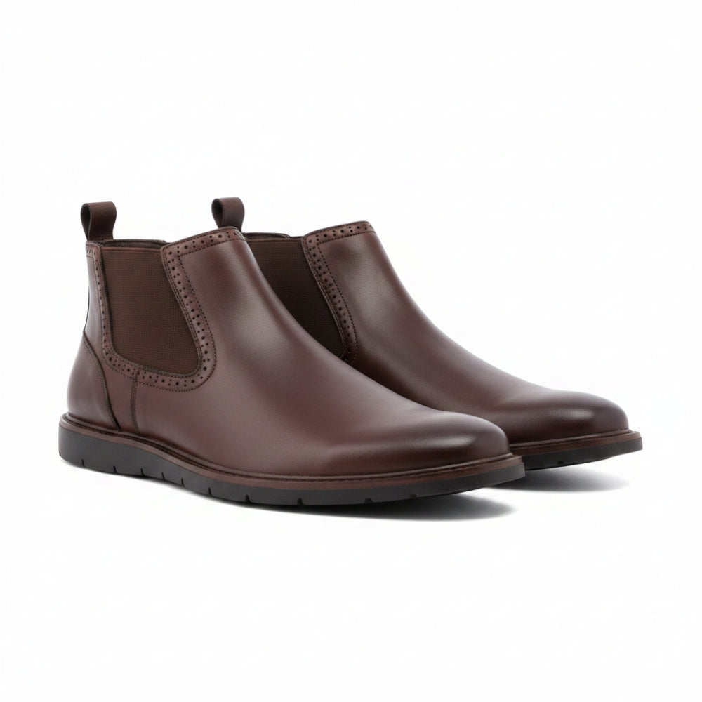 A dark brown leather Chelsea boot with elastic side gore panels and a pull tab, shown from a side profile on a white background.