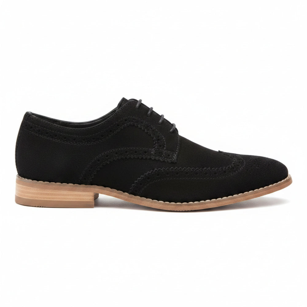 A single black suede wingtip oxford shoe with a tan and black stacked heel, shown from a three-quarters angle on a white background.