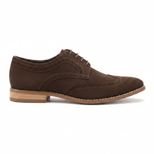 A dark brown suede wingtip oxford shoe with brogue detailing, laces, and a stacked leather sole, shown on a white background.