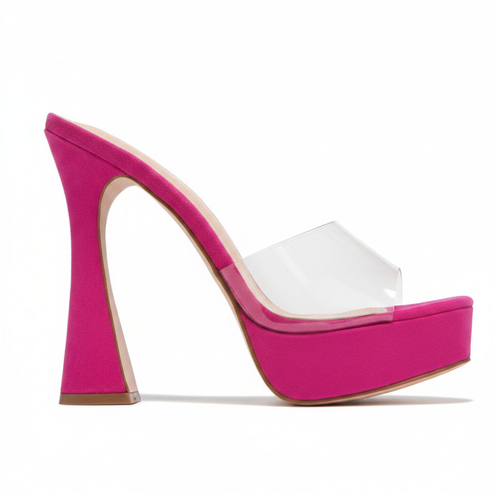 A bright pink platform mule sandal with a high stiletto heel and a transparent pink toe strap, shown against a plain white background.