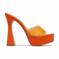 An orange platform mule high heel shoe with a chunky block heel and a translucent orange-yellow toe strap, shown against a plain white background.