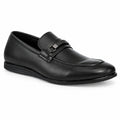 A black leather penny loafer with a decorative strap and silver-tone buckle, shown from a three-quarters angle on a white background.
