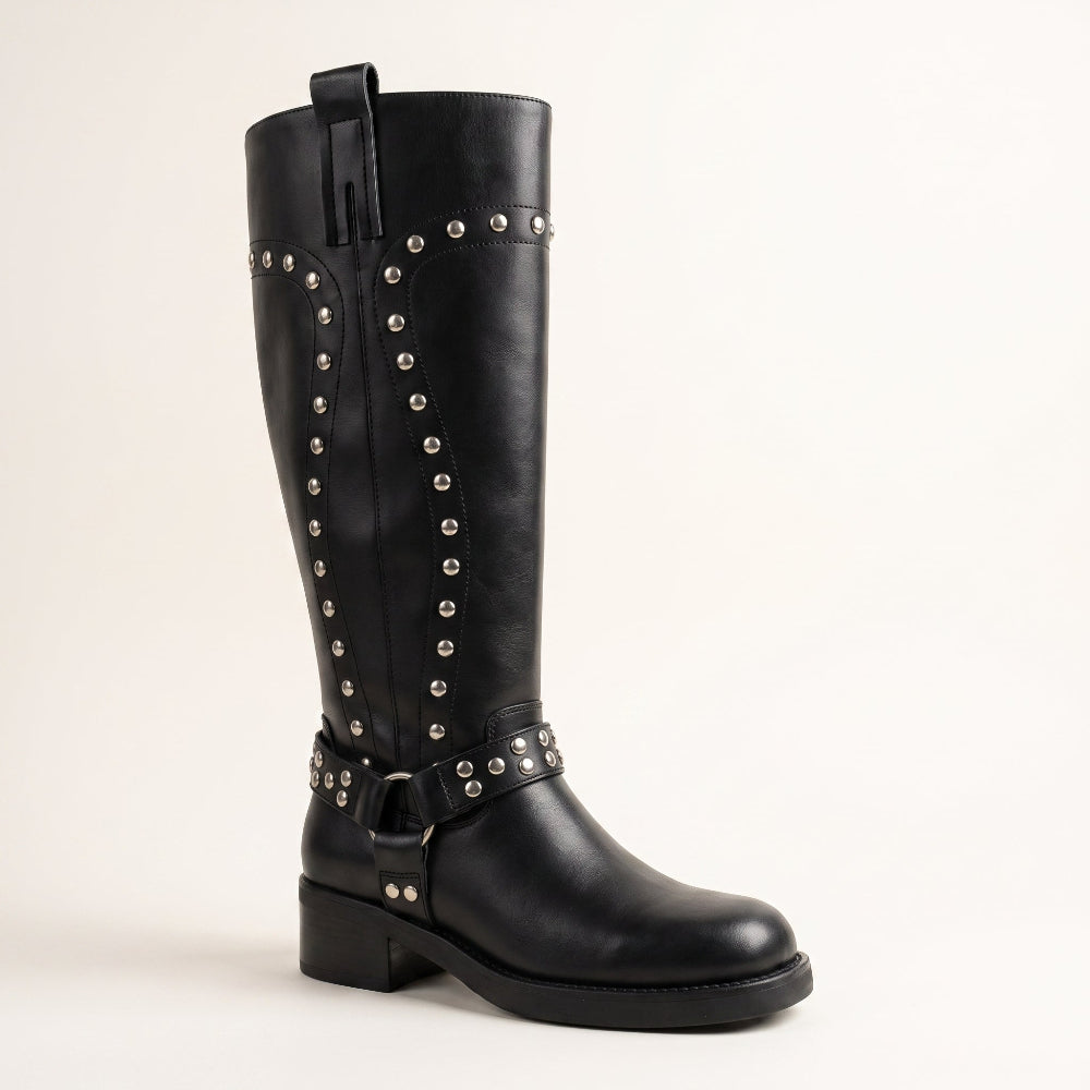 A black leather knee-high riding boot with silver-tone metal studs and a decorative buckle strap around the ankle, shown against a plain light background.