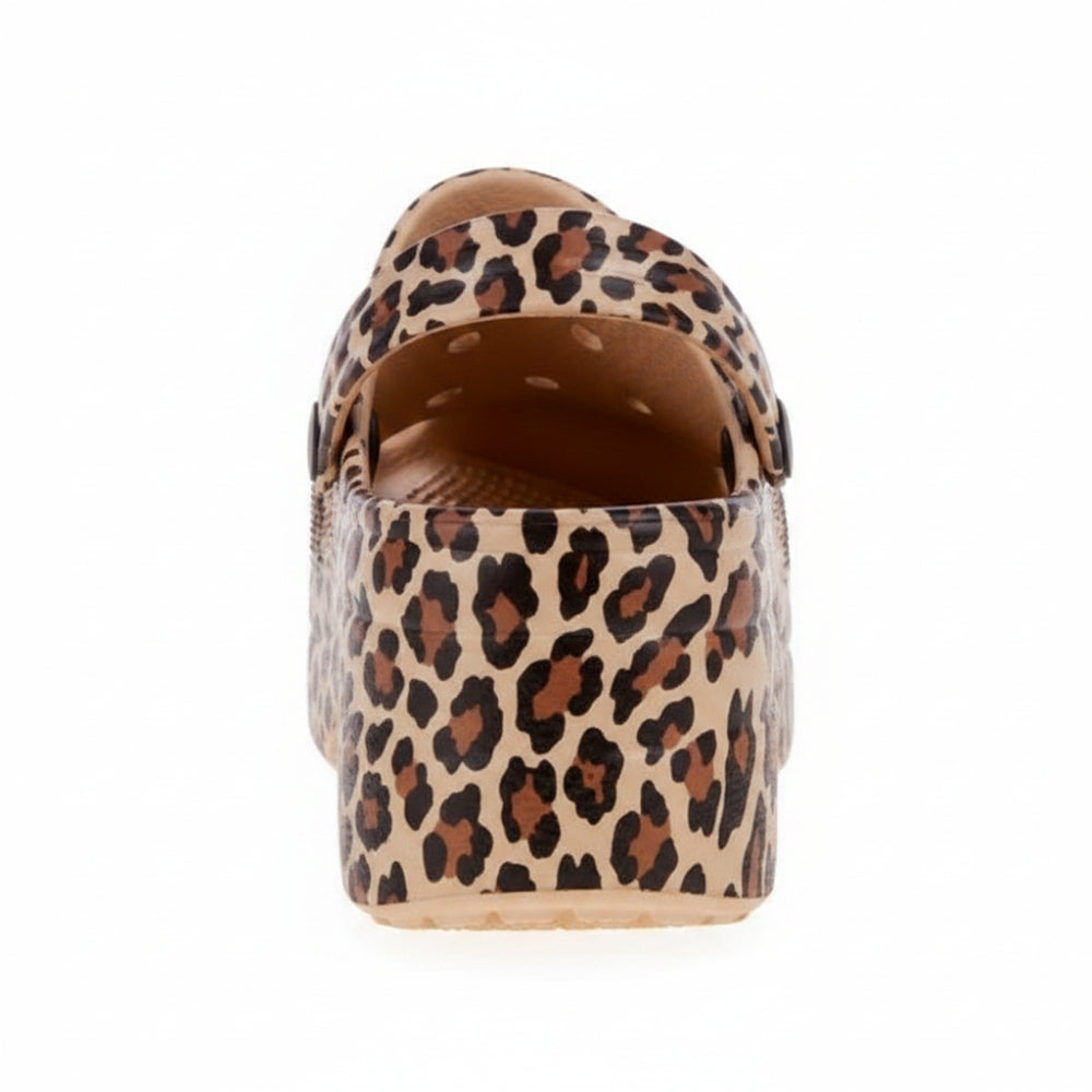 A single platform clog shoe with a brown and black leopard print pattern on a beige background, shown against a plain white background.
