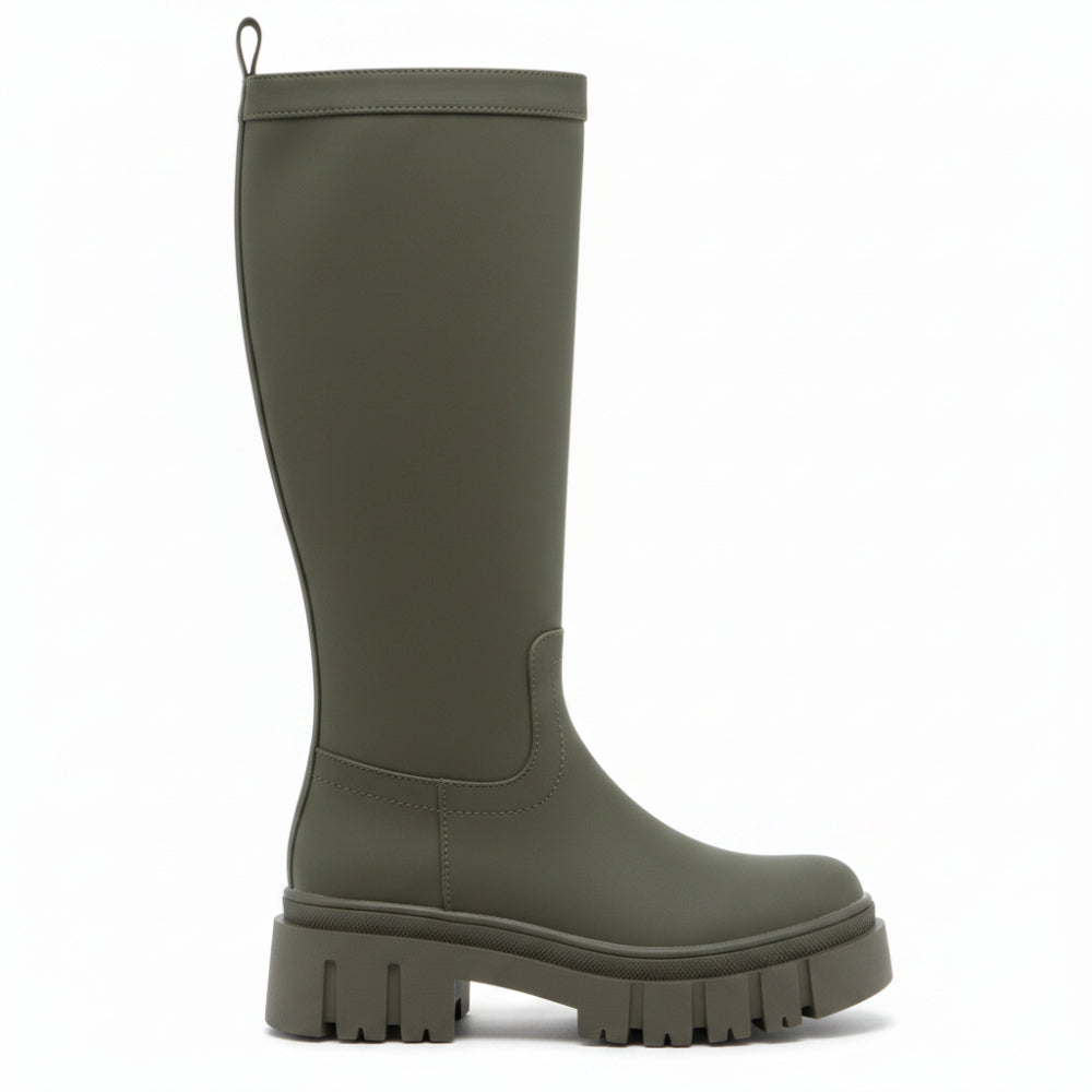 An olive green knee-high boot with a chunky lug sole, shown from a side profile on a white background.