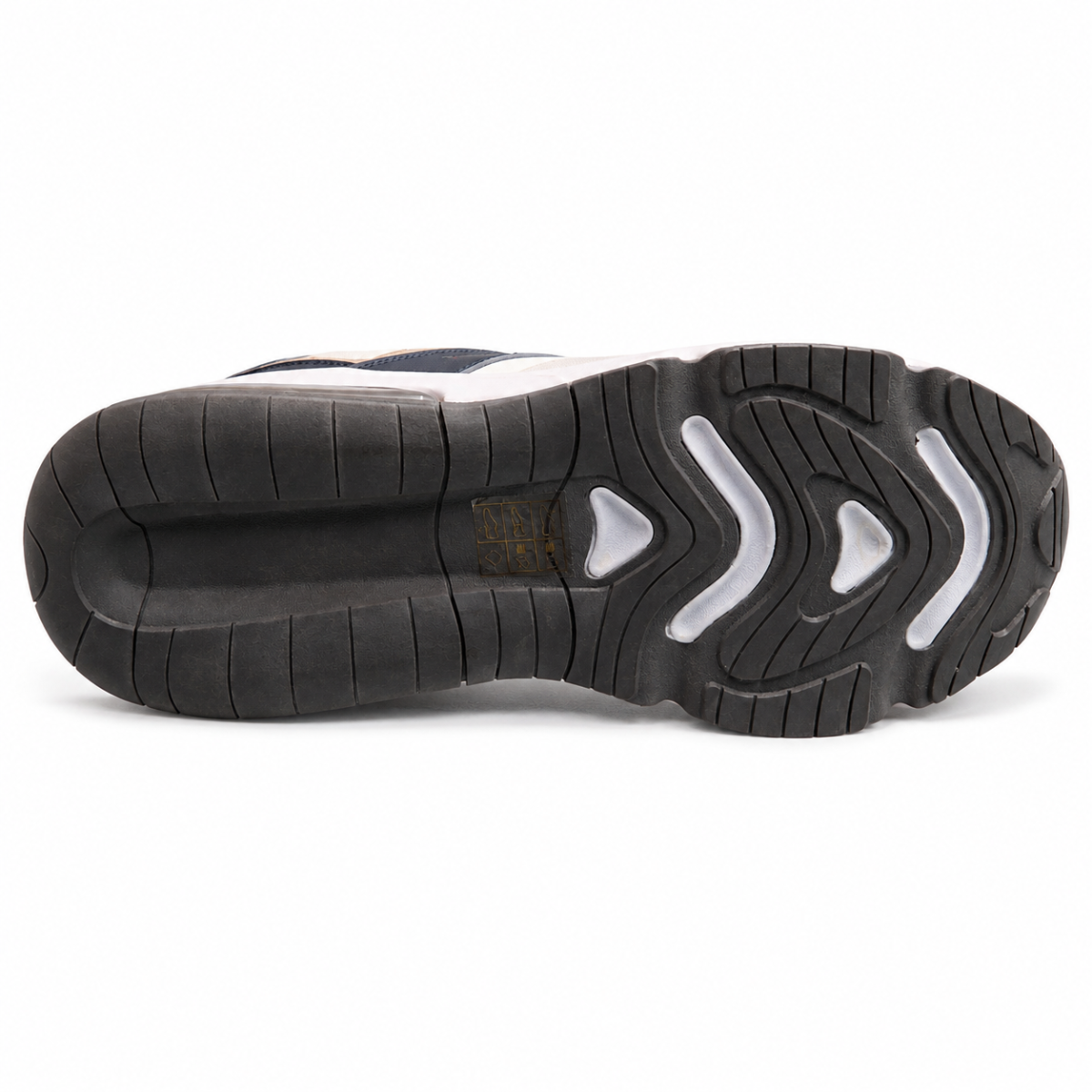 The outsole of a sneaker shown from a top-down view, featuring a black treaded rubber base with white geometric accents and a small gold logo in the center.