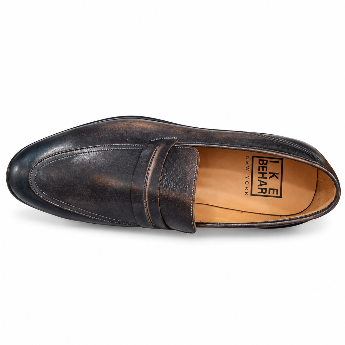 A single dark brown leather penny loafer shown from a top-down view on a white background. The shoe features a distressed finish with subtle tonal variation, a classic penny strap, and a tan interior with the 'LIKE BEAR NEW YORK' logo printed on the insole.