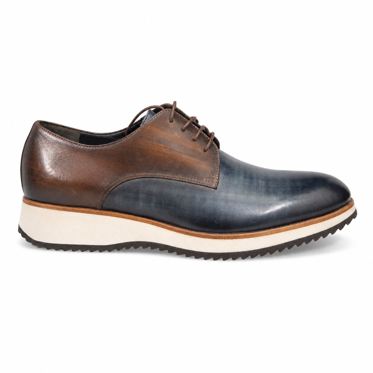A men's low-top lace-up dress shoe with a color-blocked design featuring dark brown leather on the upper, a dark blue-gray leather toe, and a thick cream-colored midsole with a black tread.