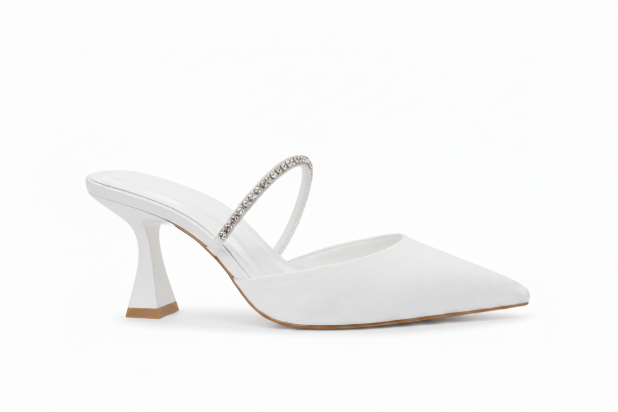 A white pointed-toe mule high heel with a curved back strap embellished with sparkling rhinestones, shown from a side profile on a clean white background.