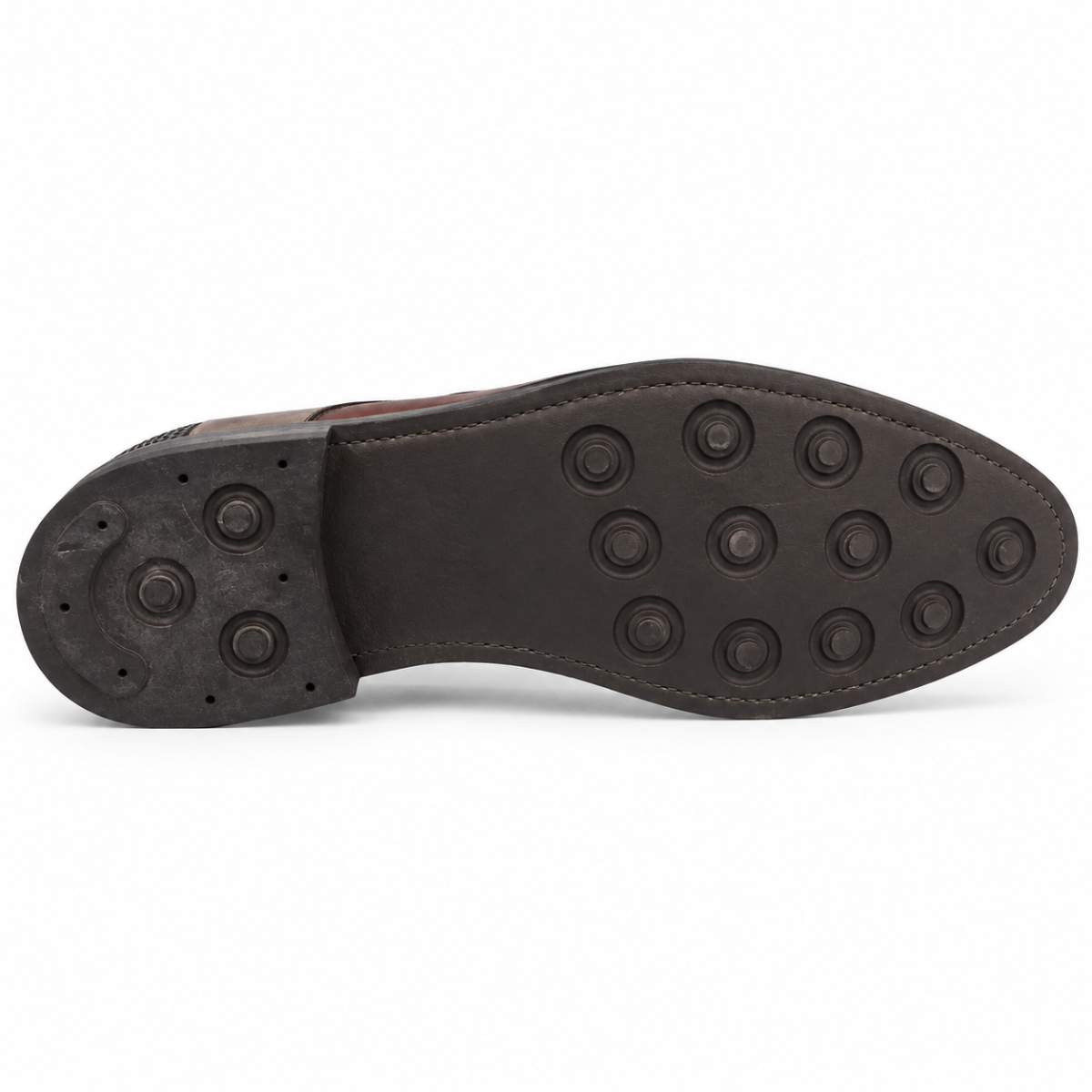 The outsole of a dark brown leather shoe, showing a pattern of circular rubber studs on the heel and toe, photographed against a solid white background.