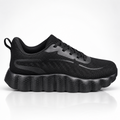 A black athletic sneaker with a textured mesh upper, black laces, and a chunky, wavy black sole, shown in a side profile on a white background with a soft reflection.