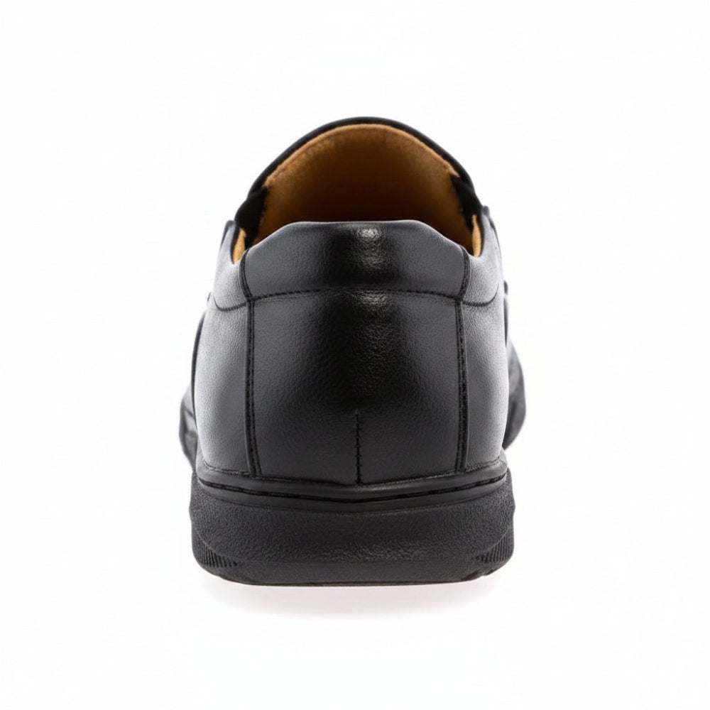 A black slip-on leather shoe with a tan interior lining and a black sole, shown from a three-quarters angle on a white background.
