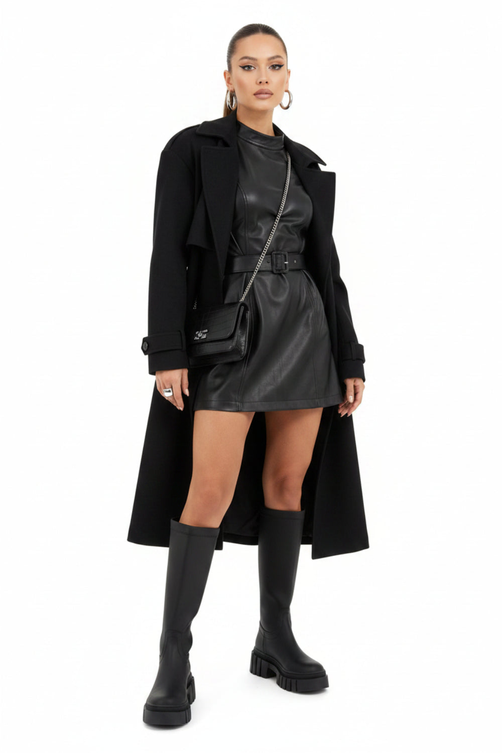 A single black knee-high rubber rain boot with a chunky lug sole, shown in a side profile on a white background.