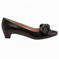 Black shoe with a bow on a white background