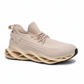 A single beige knit athletic sneaker with a thick, sculpted wavy sole, shown against a plain white background.