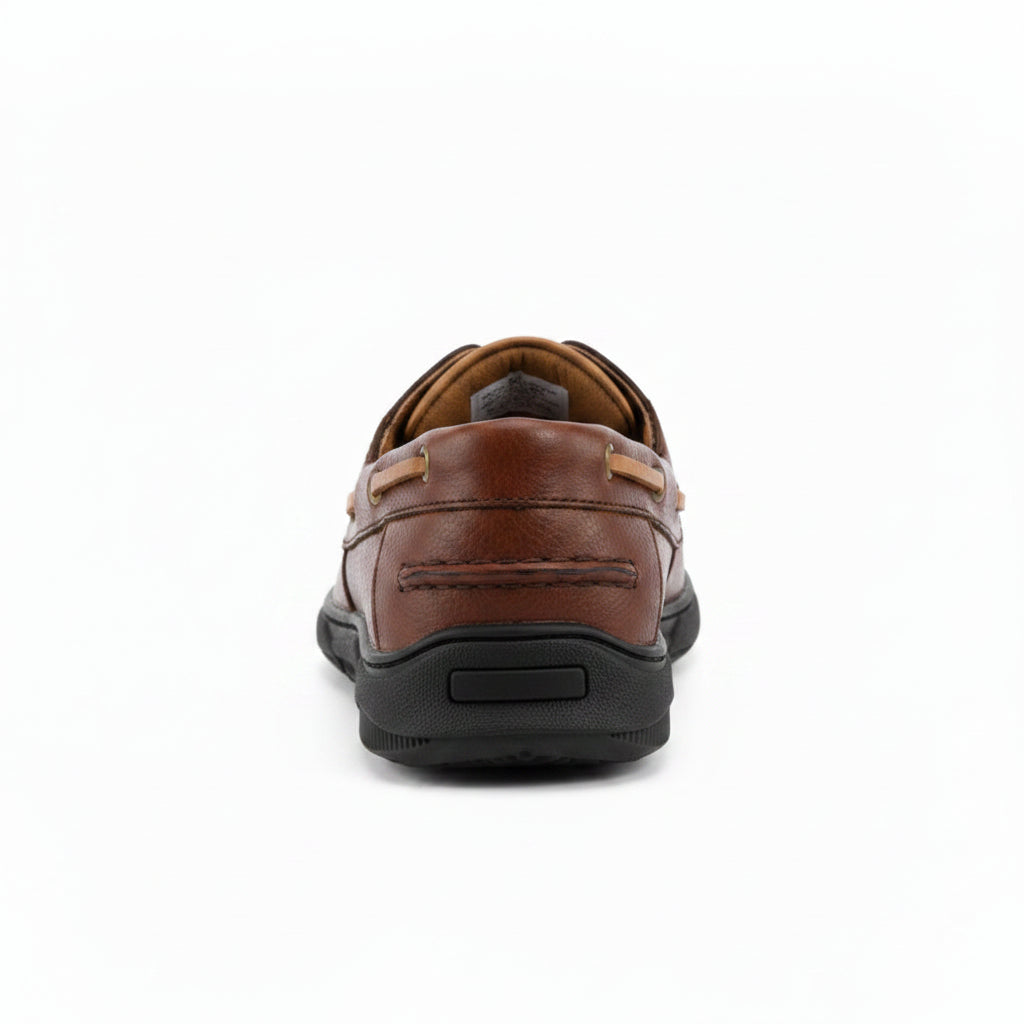 A brown leather boat shoe with tan laces and brass-tone eyelets, shown in a side profile on a white background.