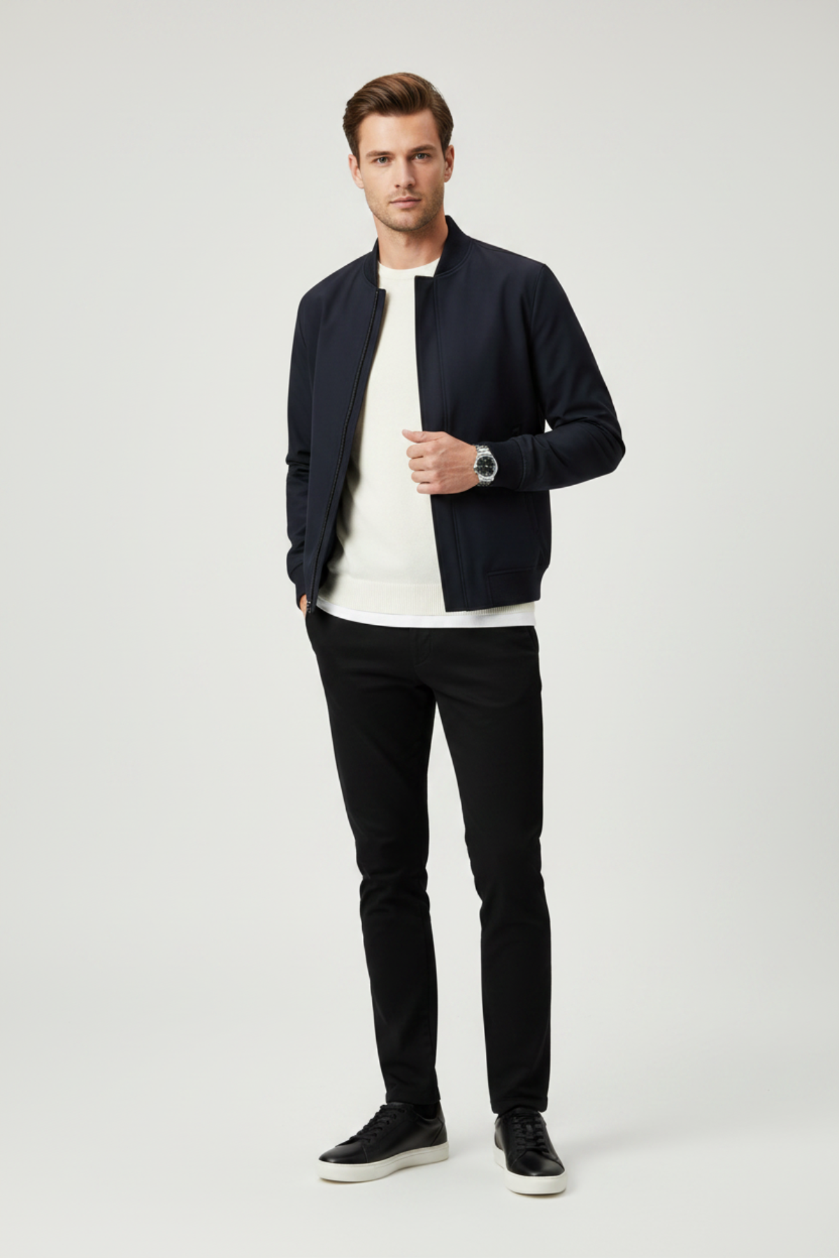 a man wearing a leather sneakers in black color 