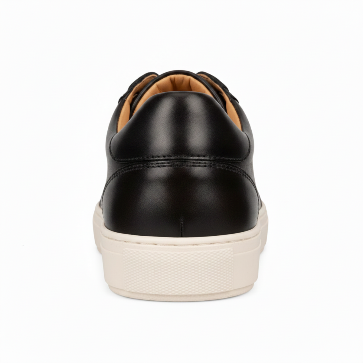 A single black leather low-top sneaker shown from a rear three-quarter view, featuring a textured off-white sole, set against a plain white background.